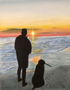 Man and dog watch the sunset